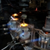 A wine glass is being polished on the production line