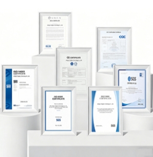 Global Compliance and International Authoritative Quality Certification Booth (Certified Quality for Global Markets) ISO 360 System and CE/SGS/CQC Honor Wall A photograph taken against a pristine white background showcases the company's 3D booth displaying its global compliance and internationally recognized quality certifications (Certified Quality for Global Markets). Seven international certification documents, each framed in elegant white, are arranged in a staggered, undulating fashion on several modern, miniature, white circular and rectangular geometric display stands. In the foreground, two certificates stand side-by-side: on the left, an ISO 45001 Occupational Health and Safety Management System certification with a blue geometric curved border; on the right, an ISO 9001 Quality Management System certification with the same design. Both certificates feature a clear black SGS logo at the bottom. On the left-hand, mid-ground display stand, stands an ISO 14001 Environmental Management System certification with a long, continuous blue color block. At the highest central display stand, arranged from left to right, are: UKCA certification, EU CE safety compliance certification, China CQC quality certification, and another international product inspection certificate issued independently by SGS in blue lettering. All the certificates are neatly formatted and appear extremely dignified and crisp under the soft, pure white light. The entire image is free of unnecessary distractions, perfectly showcasing the compliance foundation and core trust assets of this major foreign trade manufacturer in the fields of international green, low-carbon, and high-quality industrial manufacturing through its exquisite white geometric pedestal and multiple top international certifications.