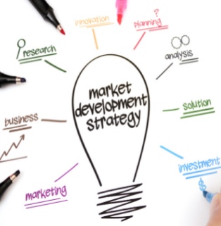 Global B2B Foreign Trade Global Market Expansion Strategy Mind Map (Active Market Development) | Enterprise International Marketing Strategy and Business Needs Analysis | Whiteboard Hand-drawn Illustrations A modern business hand-drawn mind map marketing illustration taken against a clean, pure white background, designed to showcase a company's global market expansion and marketing strategy (Active Market Development). At the center of the image is a large, simple black line drawing of a light bulb, inside which the core business concept, 'market development strategy,' is neatly written in black handwritten artistic font. Centered around this giant, creative light bulb, eight English business keywords, written in different colored markers and accompanied by underlines or miniature line drawings, radiate outwards: from top to bottom on the left, there is 'research' in green (with a magnifying glass icon), 'business' in brown (with a reddish-brown upward-sloping line arrow), and 'marketing' in purple; above that, there is 'innovation' in orange and 'planning' in red with a question mark; from top to bottom on the right, there is 'analysis' in dark green (with two overlapping circular gear icons), 'solution' in light green, and 'investment' in bright blue in the lower right corner (with a thin dollar sign $ below). Around the perimeter of the whiteboard, four colored marker nibs are arranged diagonally, some in progress and others about to be used for writing (including a black one in the upper left corner, one on the left, one at the bottom, and a pink marker with a section of its top edge sticking out). In the lower right corner, a hand can be vaguely seen holding a blue marker and writing a dollar sign. The entire image is well-composed, brightly colored, and logically structured, seamlessly integrating the creative light bulb symbol with a comprehensive modern B2B foreign trade business expansion strategy, fully showcasing the company's professional aesthetic quality in the field of international digital marketing and strategic planning.