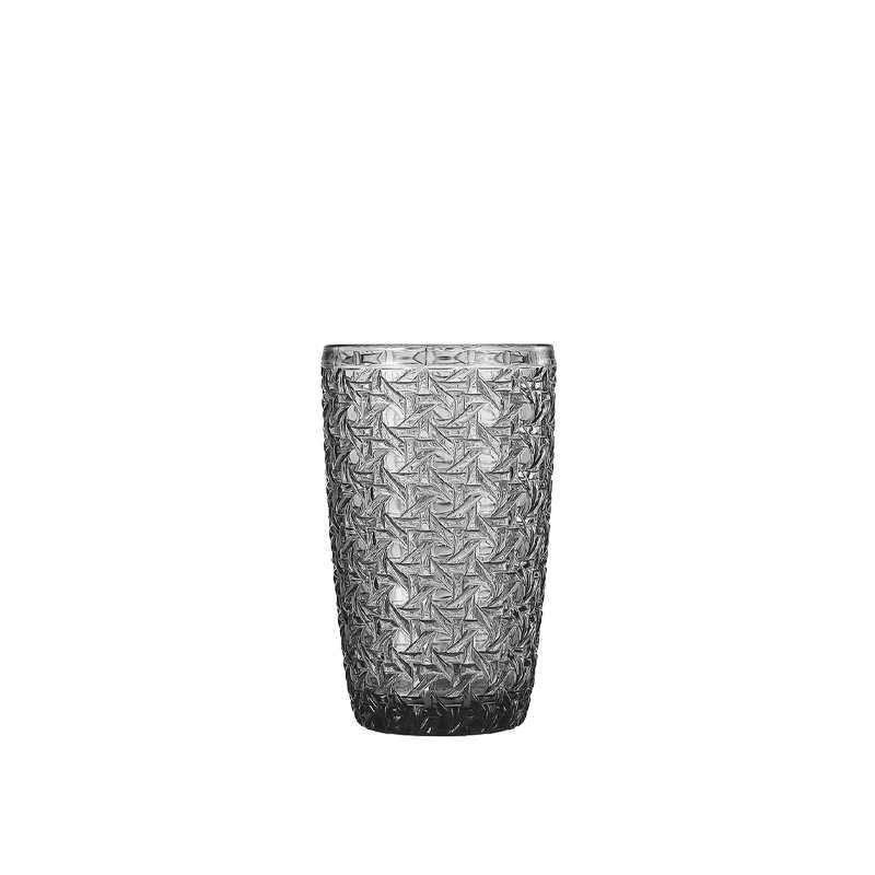 This is a product photo featuring Xinghuo Glass's bulk textured glass cups against a pure white background, a standard B2B e-commerce main image style. The photo showcases the glass cups against a pristine white background. At the center of this pristine