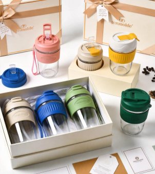 The opened premium gift box contains Xinghuo Glass portable glasses in various colors and custom accessories.
