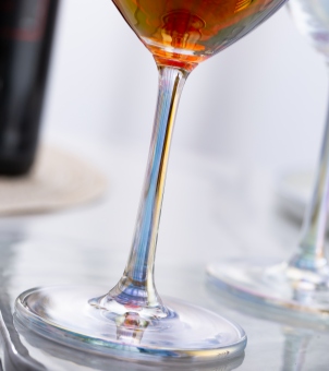 Close‑up of Xinghuo Glass iridescent stemmed wine glass base and stem
