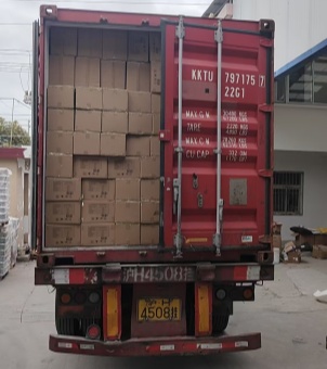 Xinghuo Glass coffee cup cartons destined for European chain brands were tightly stacked inside a red shipping container.