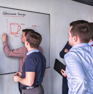 XINGHUO Glass design and engineering team collaborating on new glassware concepts