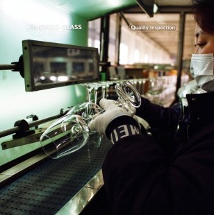 XINGHUO Glass quality inspectors checking glassware details by hand