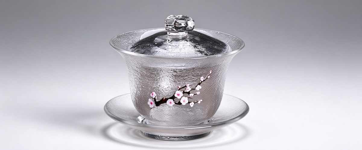 Hammered borosilicate glass gaiwan with hand-painted plum blossom, used for hot tea