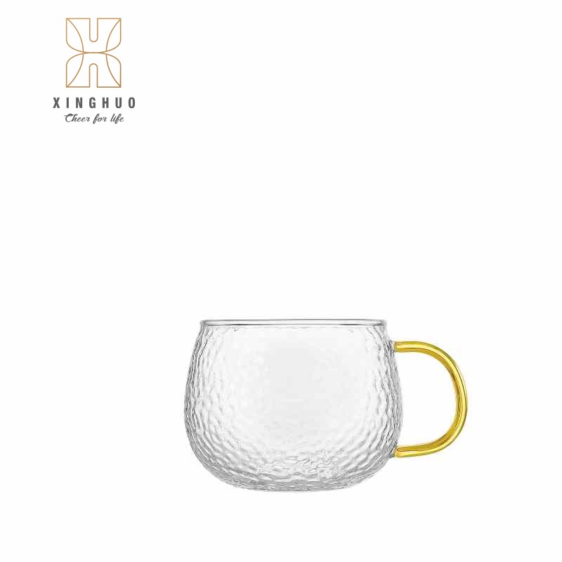Image of a yellow-handled, high-silicon borosilicate hammered glass mug.